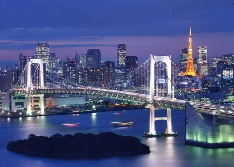 Tokyo skyline at night with Rainbow Bridge and Tokyo Tower